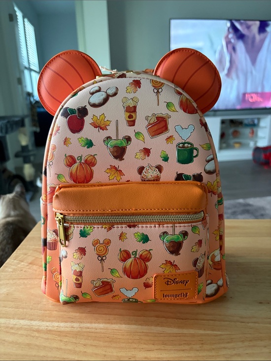 Loungefly Handbags - Loungefly Orange Pumpkin Ear Mini Backpack with Autumn Treats Print